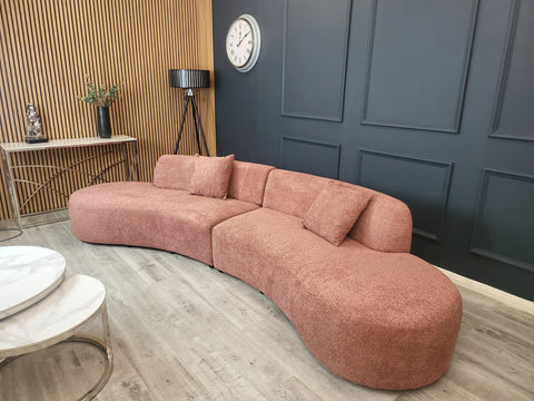 Luxury Miami curved 6-seater bouclé sofa with sculptural organic silhouette, deep cushioned seating.