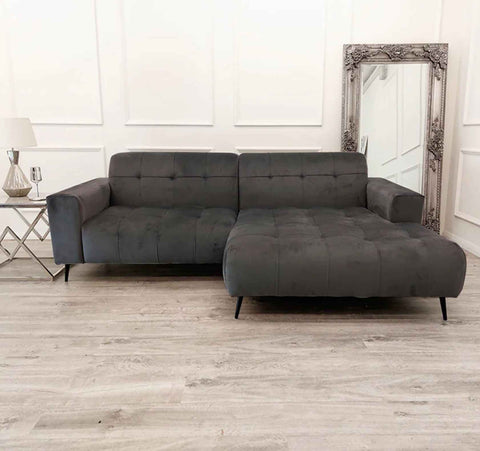 Luxury cinema sofa with plush velvet upholstery, deep cushioned seating, extended chaise lounge, and spacious contemporary corner design for modern UK living rooms.