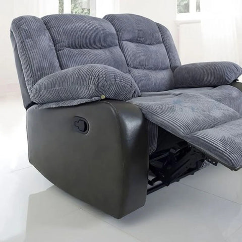 Elephant grey cord recliner sofa with integrated cup holder console for family living.