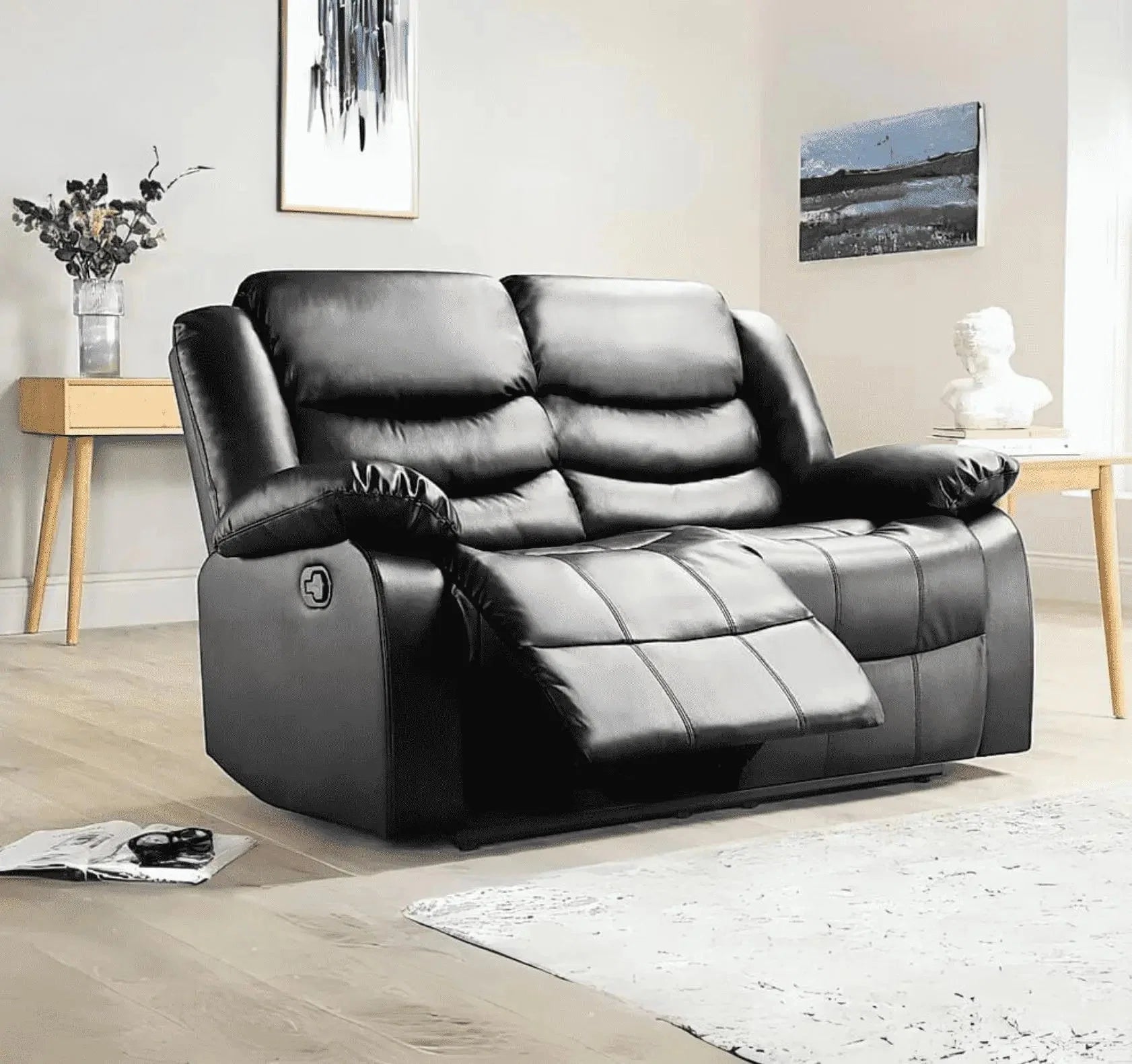 Roma black 2 seater recliner sofa with supportive cushioned seating.
