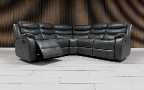 Modern grey leather corner sofa featuring reclining seats and convenient built-in cupholders.