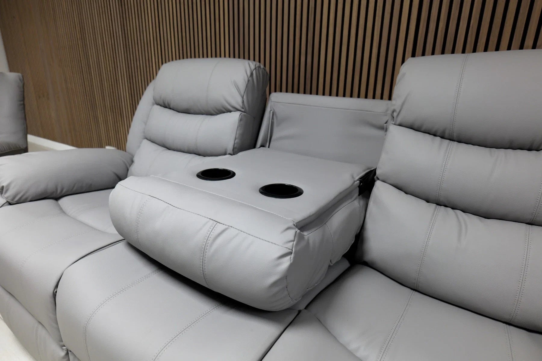 Roma grey 2 seater recliner sofa with plush cushions and supportive seating.