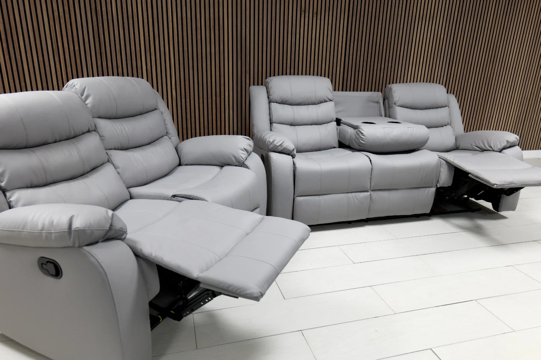 Modern grey air leather 3 seater recliner sofa for contemporary living rooms.