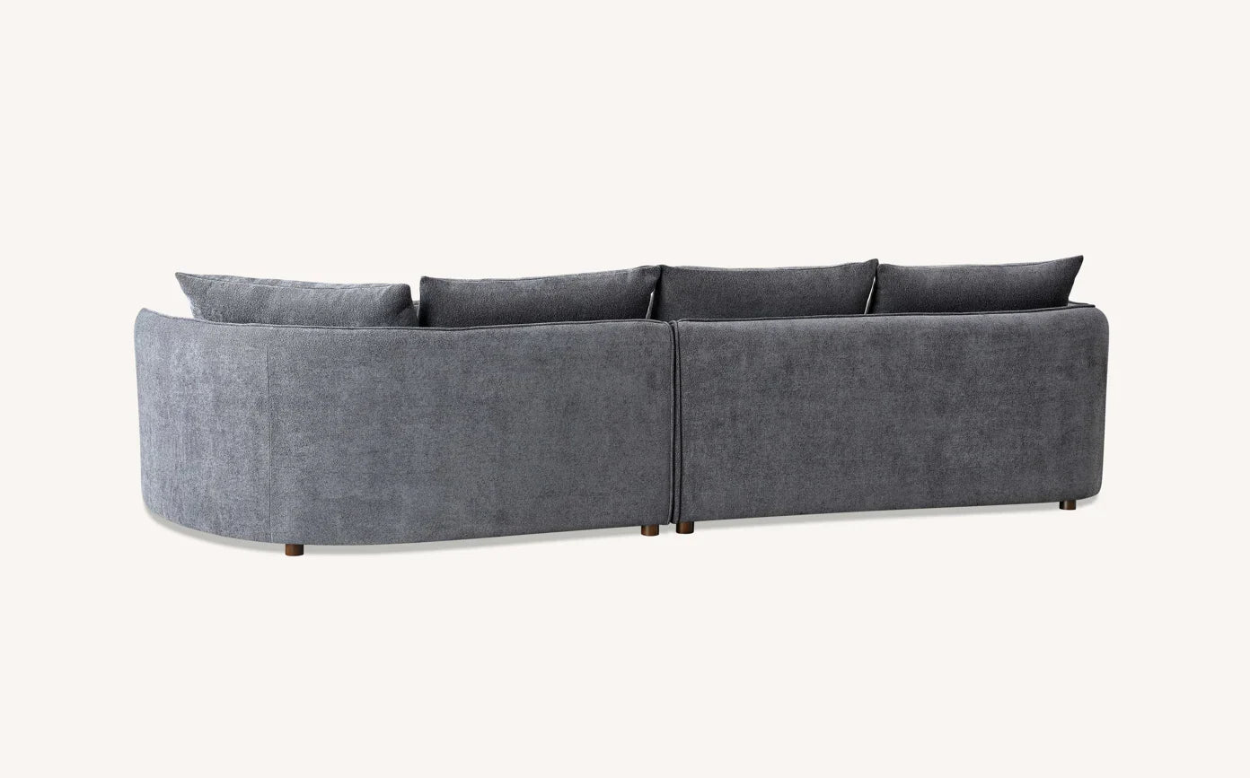 curved bouclé corner chaise sofa in Pebble and Charcoal with a sculptural organic design.