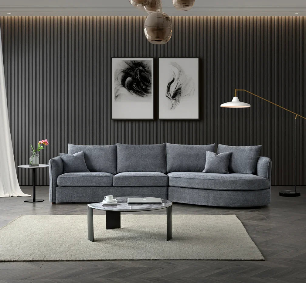 Luxury curved bouclé corner chaise sofa in Pebble and Charcoal with deep cushions, and premium upholstery for modern UK living rooms.