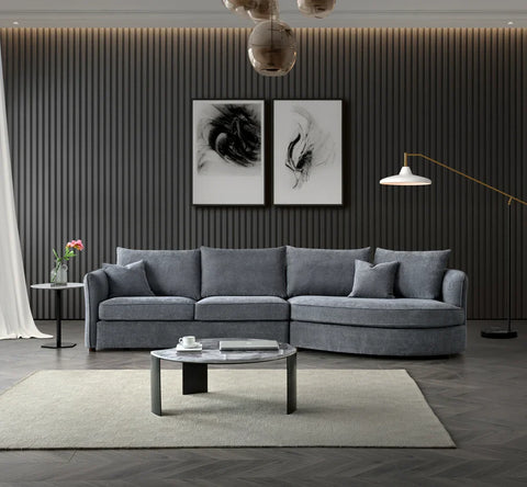 Luxury curved bouclé corner chaise sofa in Pebble and Charcoal with deep cushions, and premium upholstery for modern UK living rooms.