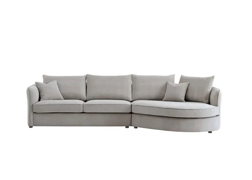 Luxury curved bouclé corner chaise sofa in Pebble and Charcoal with a sculptural organic design, deep cushions, and premium upholstery for modern UK living rooms.