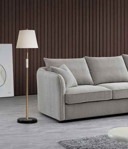 Luxury curved bouclé corner chaise sofa in Pebble and Charcoal with a sculptural organic design, deep cushions, and premium upholstery for modern UK living rooms.