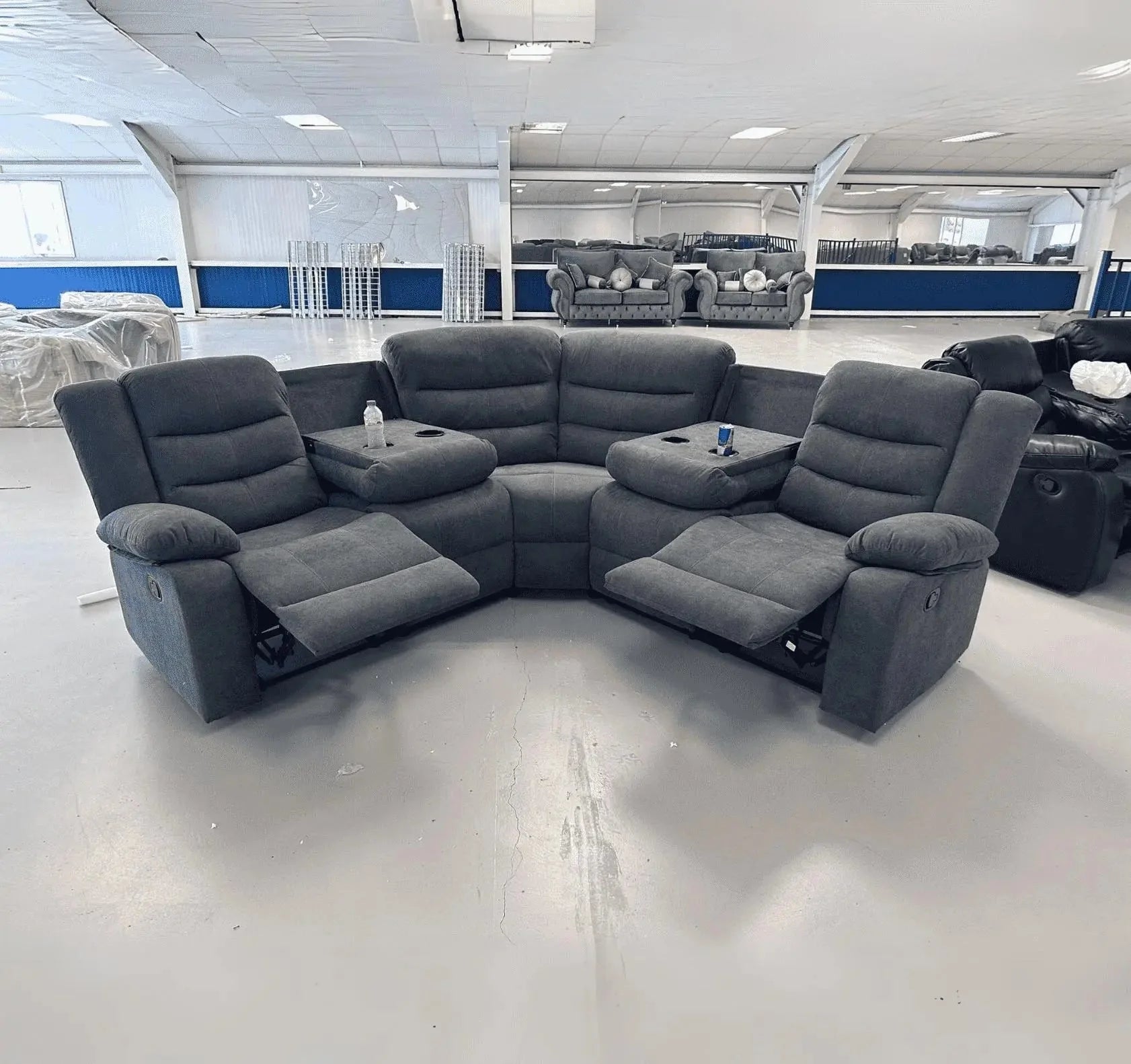 Contemporary L-shaped grey fabric recliner sofa designed for family comfort.