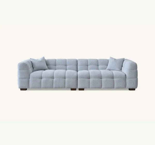 Luxury Tribeca Pearl Bouclé sofa featuring sculptural curved arms, deep channel stitching and contemporary designer styling for modern UK homes.