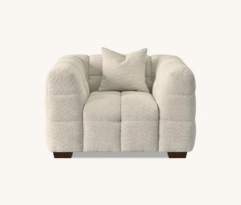 oatmeal bouclé sofa with sculptural curved silhouette, deep channel stitching, premium textured upholstery, and contemporary designer styling for modern UK homes.