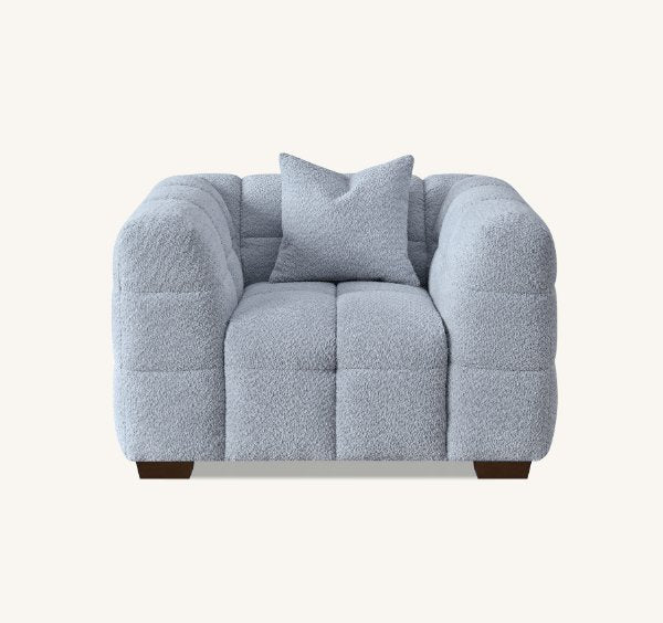 Luxury Tribeca Pearl Bouclé sofa featuring sculptural curved arms, deep channel stitching, premium textured upholstery.