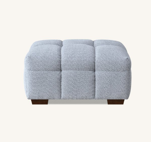 Luxury Tribeca Pearl Bouclé sofa featuring sculptural curved arms, deep channel stitching, premium textured upholstery, and contemporary designer styling for modern UK homes.