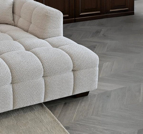 Tribeca oatmeal bouclé corner sofa with sculptural curved arms, deep channel stitching, premium textured upholstery, and spacious L-shaped seating for modern UK homes.