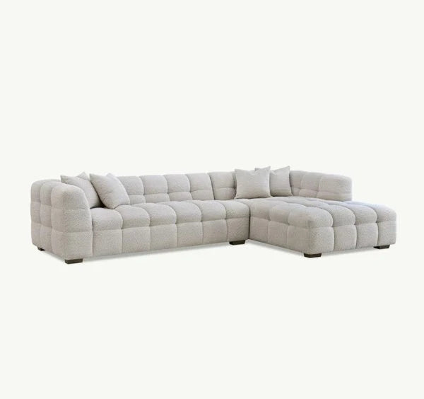 Luxury Tribeca oatmeal bouclé corner sofa with sculptural curved arms, deep channel stitching