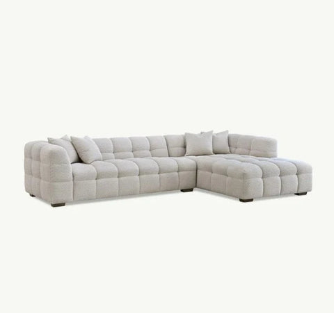 Luxury Tribeca oatmeal bouclé corner sofa with sculptural curved arms, deep channel stitching