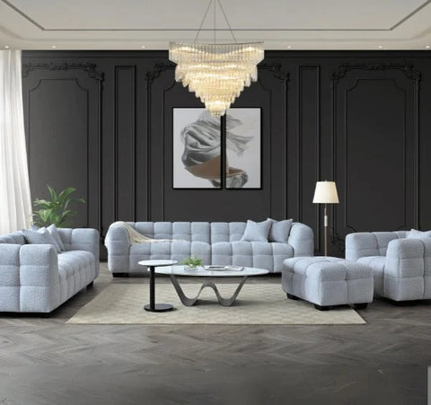 Luxury Tribeca Pearl Bouclé sofa featuring sculptural curved arms, deep channel stitching, premium textured upholstery, and contemporary designer styling for modern UK homes.